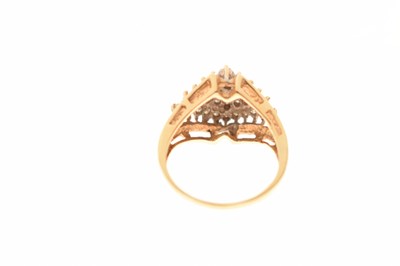 Lot 12 - Diamond cluster yellow metal ring