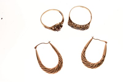Lot 94 - Two red stone set rings and a pair of earrings