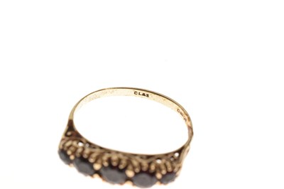 Lot 94 - Two red stone set rings and a pair of earrings