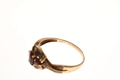 Lot 94 - Two red stone set rings and a pair of earrings