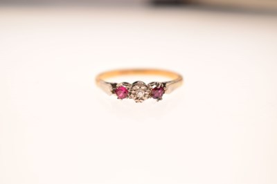 Lot 44 - Illusion set diamond and ruby three-stone ring, stamped '18ct'