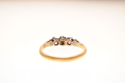 Lot 44 - Illusion set diamond and ruby three-stone ring, stamped '18ct'