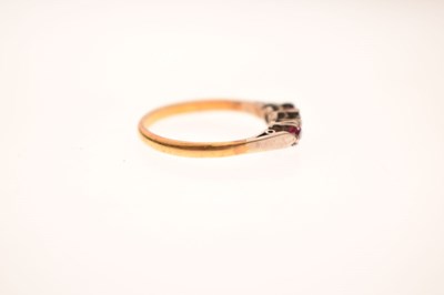 Lot 44 - Illusion set diamond and ruby three-stone ring, stamped '18ct'