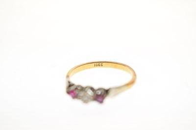 Lot 44 - Illusion set diamond and ruby three-stone ring, stamped '18ct'