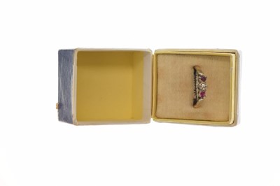 Lot 44 - Illusion set diamond and ruby three-stone ring, stamped '18ct'