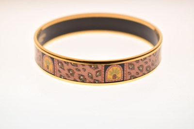 Lot 68 - Hermès, Paris - Enamel bangle or bracelet, with leopard print design