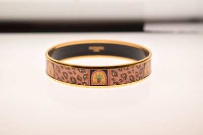 Lot 68 - Hermès, Paris - Enamel bangle or bracelet, with leopard print design