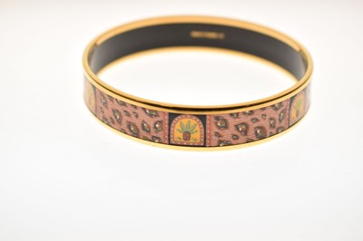 Lot 68 - Hermès, Paris - Enamel bangle or bracelet, with leopard print design