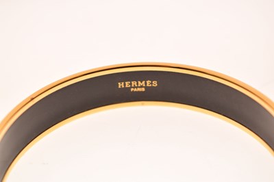 Lot 68 - Hermès, Paris - Enamel bangle or bracelet, with leopard print design
