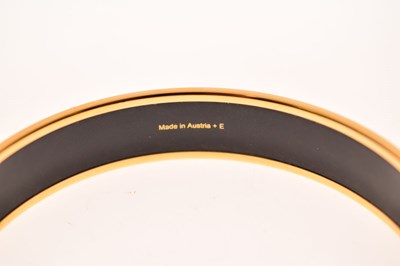 Lot 68 - Hermès, Paris - Enamel bangle or bracelet, with leopard print design