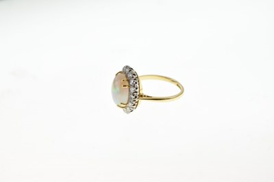 Lot 28 - Opal and diamond 18ct gold cluster ring