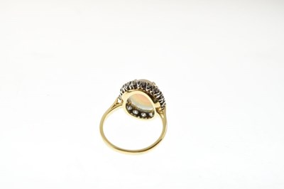 Lot 28 - Opal and diamond 18ct gold cluster ring