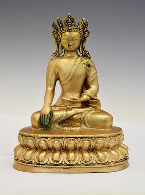 Lot 332 - Himalayan gilt alloy figure of Buddha Shakyamuni