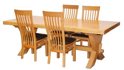 Lot 455 - Oak dining table and four 'Leon' chairs