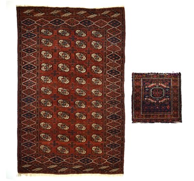 Lot 431 - Mid 20th century Tekke rug and a bag face
