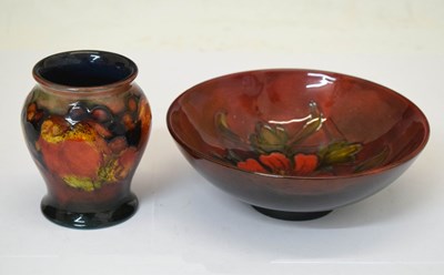 Lot 624 - Moorcroft flambé - 'Leaf and Berry' vase and bowl