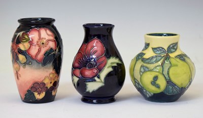 Lot 630 - Moorcroft - Three small vases in the 'Oberon', 'Pears' and 'Anemone' patterns