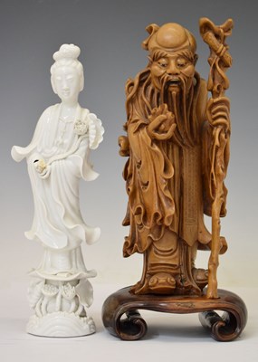 Lot 313 - Chinese carved rootwood figure of Shoulao and blanc de chine Kwanyin