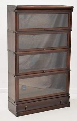 Lot 466 - Globe Wernicke oak four-section mahogany modular bookcase