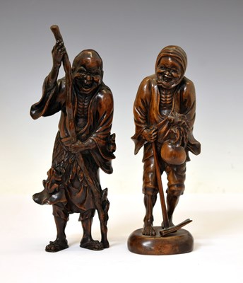 Lot 351 - Two Japanese carved fruitwood okimono figures