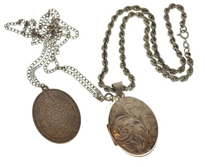 Lot 73 - Engraved silver oval locket on a '925' silver rope chain