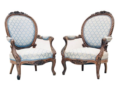 Lot 503 - Pair of French Louis XV-style carved walnut fauteuils or open armchairs