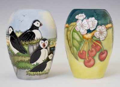 Lot 620 - Moorcroft - Ovoid 'Puffins' vase and 'Cherries' vase