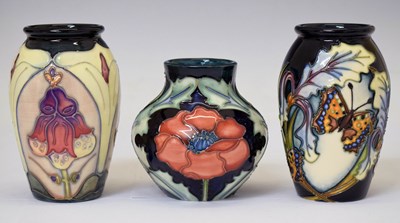 Lot 632 - Moorcroft - Three small vases