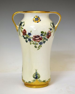 Lot 307 - William Moorcroft MacIntyre '18th Century' pattern twin-handled vase