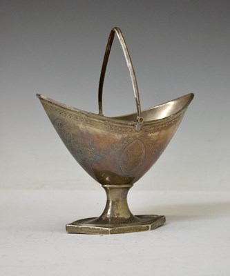 Lot 136 - George III silver neoclassical boat-shaped pedestal sugar basket with swing handle