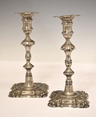 Lot 156 - Matched pair of George II silver cast candlesticks