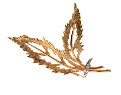 Lot 63 - 9ct gold diamond set leaf or feather-design brooch