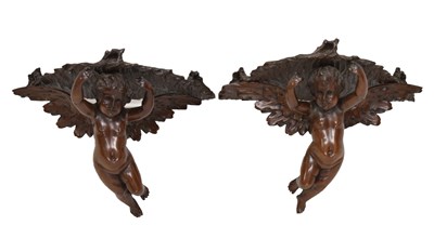 Lot 494 - Pair of late 19th or early 20th century Italian carved fruitwood wall brackets