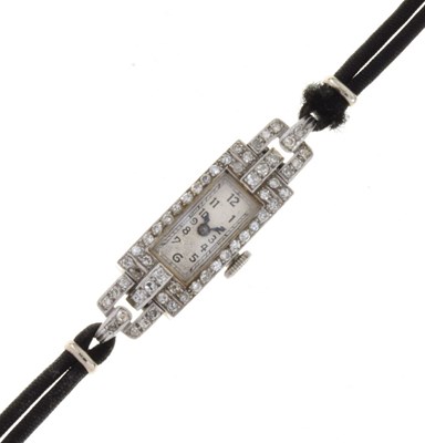 Lot 144 - Lady's diamond set platinum cocktail watch