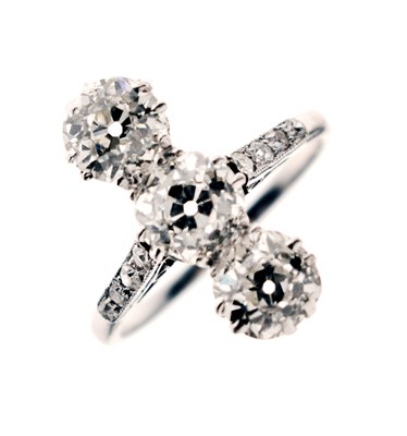 Lot 11 - Early 20th century diamond three stone white metal ring