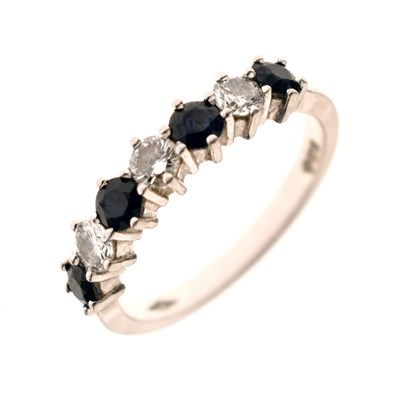 Lot 16 - Diamond and sapphire platinum seven stone half eternity ring