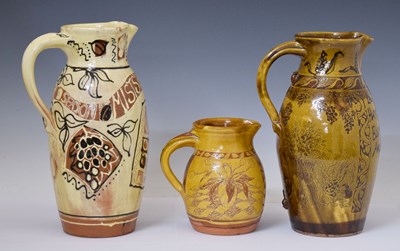 Lot 455 - Three late 20th century slipware Harvest jugs
