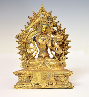 Lot 335 - Tibetan gilt alloy figure of Manjushri