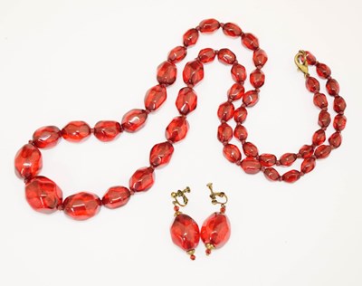 Lot 157 - Cherry 'amber' bakelite bead necklace, and a similar pair of drop earrings