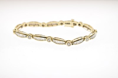 Lot 55 - Diamond 14ct yellow gold panel bracelet