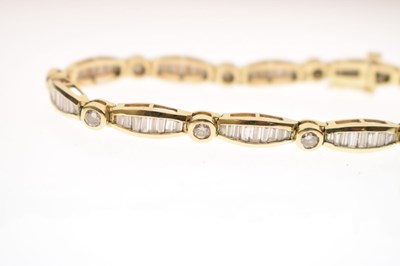Lot 55 - Diamond 14ct yellow gold panel bracelet
