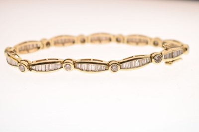 Lot 55 - Diamond 14ct yellow gold panel bracelet