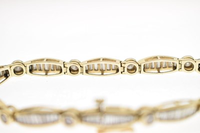 Lot 55 - Diamond 14ct yellow gold panel bracelet