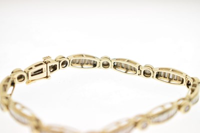 Lot 55 - Diamond 14ct yellow gold panel bracelet