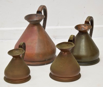 Lot 500 - Set of four copper measuring jugs