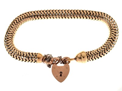 Lot 203 - Yellow metal snake link bracelet with padlock