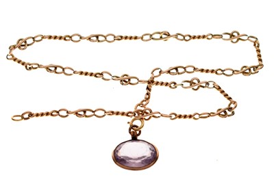 Lot 127 - Yellow metal fancy link chain, tagged '9ct', with a pale purple paste pendant
