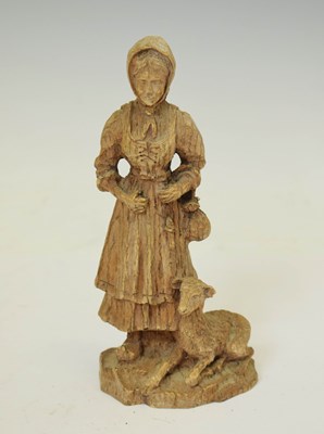 Lot 494 - 20th century carved wooden figure of an elderly lady with a lamb