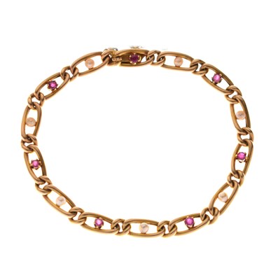 Lot 195 - Early 20th century ruby and seed pearl yellow metal bracelet