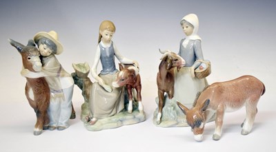 Lot 631 - Lladro - Three porcelain figure groups, and ‘Donkey Grazing’